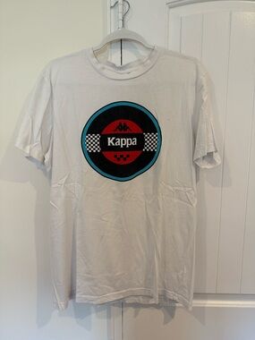 Kappa White Tee with Red, Black & Teal Emblem